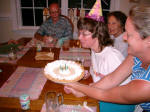 Ruth blows out the birthday candles as Diane serves