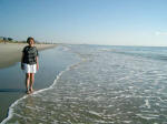 Mother on the shore with Myrtle Beach in the background