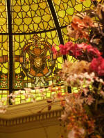 Orchid blossoms and the rotunda stained glass winged lion.