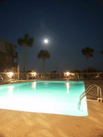 Moonrise over the swimming pool at A Place at the Beach.