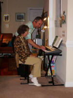 George shows Mother his new keyboard.