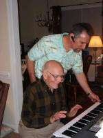 George shows Daddy his new keyboard.
