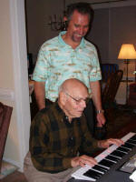 Daddy tries out George's new keyboard.