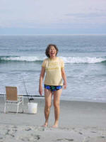 Mother laughs after coming out of the brisk water.