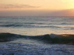 Luminescent surf at daybreak.