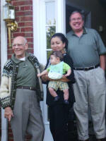 Daddy, Sandra holding Joshua, and Joe.
