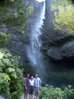 Mark and Joe stand next to Daddy on his 85th birthday, as Latourell Creek plunges a sheer 249 ft. over a rocky cliff.
