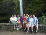 Family photo by the beautiful horsetail-shaped waterfall in the Columbia River Gorge National Scenic Area, Multnomah County, one of 77 waterfalls in Oregon's side of the Gorge.